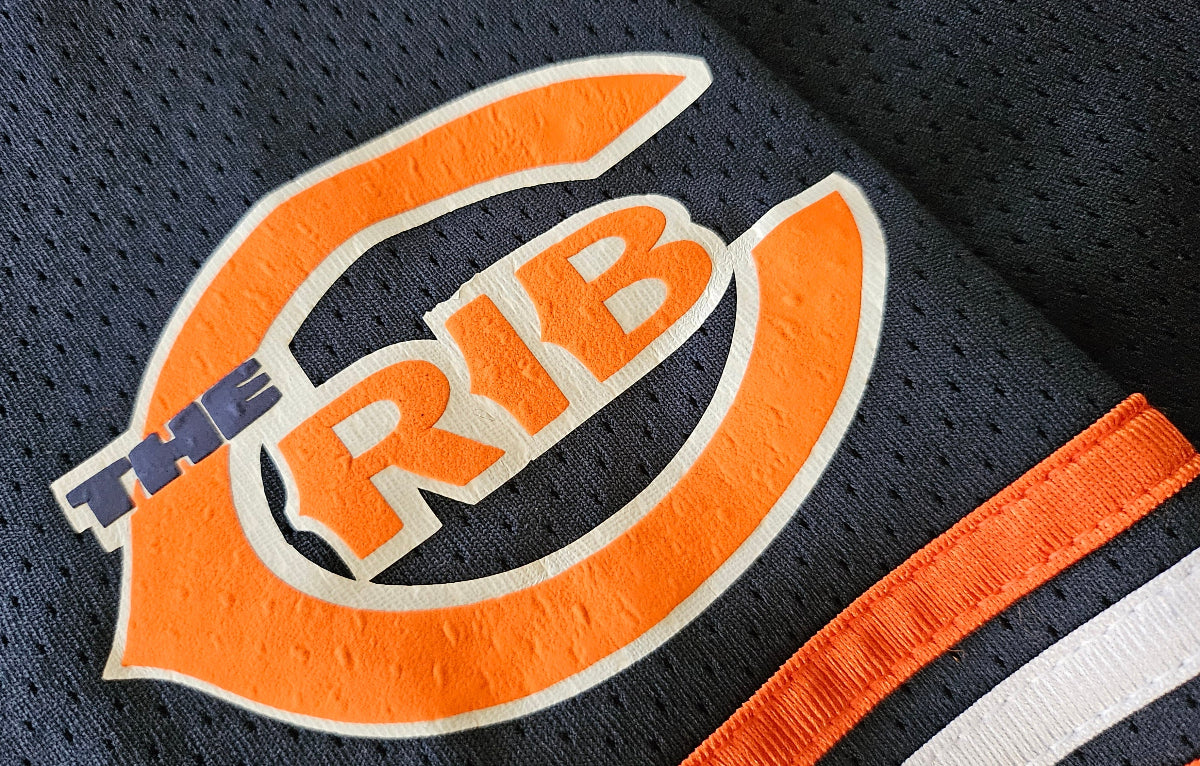 Close up on a Chicago football jersey with 'THE CRIB' logo